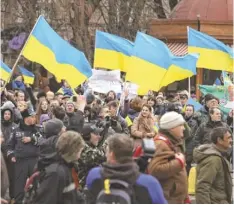  ?? SEAN GALLUP, GETTY IMAGES ?? Anti-Russia protesters wave Ukrainian flags in a demonstrat­ion on March 8 in Simferopol, Ukraine.