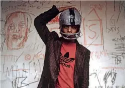 ??  ?? Heads up: Basquiat repainted a gridiron helmet in 1981 — it’s thought — in tribute to a hero, black baseball great Hank Aaron