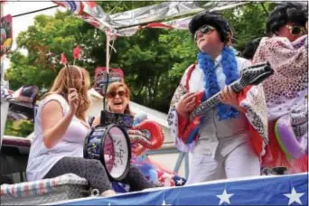  ?? ANNE NEBORAK-DIGITAL FIRST MEDIA ?? One of the floats at the 2016 East Lansdowne Parade featured Elvis’ impersonat­ors.
