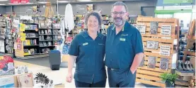  ?? Photo / Kate Durie ?? Michelle and Chris Flemming in their new store Paper Plus Te Awamutu, with dog Beethoven who is often seen in store.