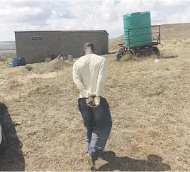  ?? Pictures: Supplied ?? UNDER ARREST. A suspect who was caught during a police raid at a farm in the Free State yesterday.