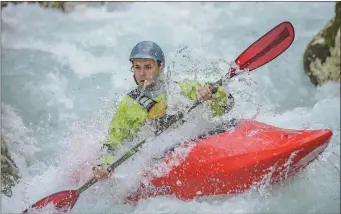  ??  ?? Finbarr O’Hanlon’s canoeist taking on the rapids in Slovenia.