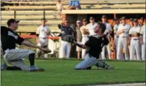  ?? AUSTIN HERTZOG - DIGITAL FIRST MEDIA ?? Boyertown catcher Anthony Rota makes a sliding catch on a popped up bunt during the PAC championsh­ip game.