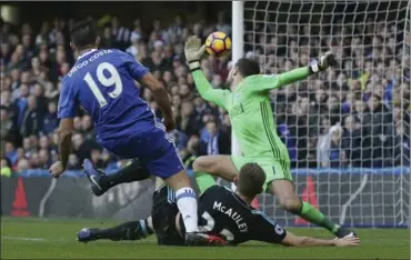  ?? TIM IRELAND, THE ASSOCIATED PRESS ?? Chelsea’s Diego Costa, left, scores a goal during the English Premier League soccer match between Chelsea and West Bromwich Albion at Stamford Bridge in London on Sunday.