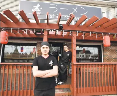  ?? Peter Hvizdak / Hearst Connecticu­t Media ?? Iishin Ramen Bar chef and co-owner Johnny Chen, left, and co-owner Penny Gao at the recently opened ramen restaurant, the first in West Haven.