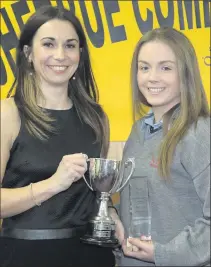  ??  ?? Aoife Cronin, Kiskeam, receiving the Corn an Runaí award from Eileen Linehan, Assistant Manager of IRD Duhallow. This award recognises courtesy, co-operation, commitment, dedication, endeavour, and enterprise.