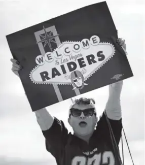  ??  ?? Labor union member Geraldine Lacy on Monday celebrates in Las Vegas after NFL team owners approved the Raiders’ future move. John Locher, The Associated Press