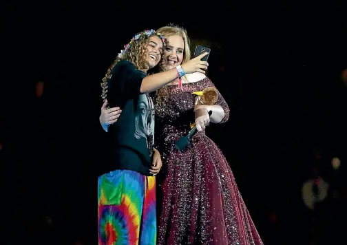  ?? PHOTO: GETTY IMAGES ?? Adele invited a fan on to the stage during her concert at Auckland’s Mt Smart Stadium on Thursday night.