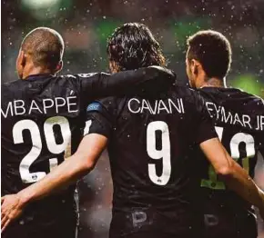  ?? AFP PIC ?? Paris Saint-Germain’s Neymar (right) celebrates with teammates Kylian Mbappe (left) and Edinson Cavani after scoring the opening goal of their UEFA Champions League match against Celtic on Tuesday.