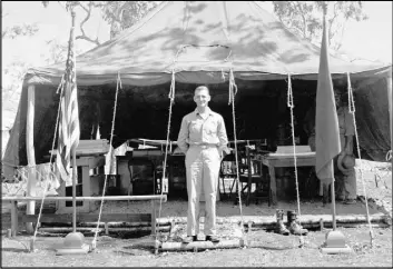  ?? The Associated Press ?? In this undated photo provided by the U.S. Air Force, Brig. Gen. Kenneth N. Walker, general of a bomber command in the Pacific, poses for a photo in front of his tent office. He disappeare­d during a bombing mission over a Pacific island in 1943.