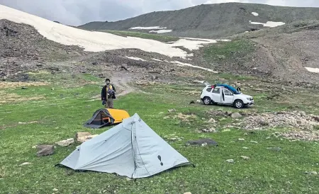  ??  ?? HIGH UP: A camp site near Kari Lake, at about 10,000 feet elevation, in Armenia.