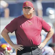  ?? [THE ASSOCIATED PRESS] ?? USC coach Clay Helton is on the hot seat as his Trojans prepare to take on Notre Dame.