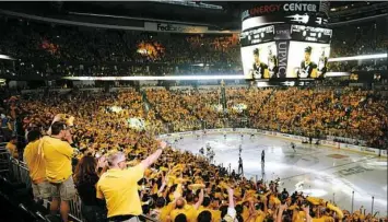  ??  ?? Penguins fans cheer Thursday at Consol Energy Center before the start of Game 7 against the Tampa Bay Lightning.