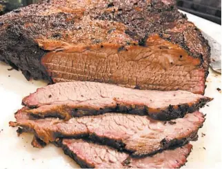  ?? DANIEL NEMAN/ST. LOUIS POST-DISPATCH ?? It took eight hours or so, but beef brisket cooked in a kamado grill turned out just like they make it in Texas.