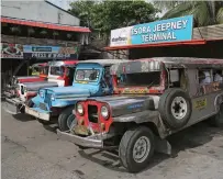  ?? AP ?? Passengers board jeepneys at a terminal in Manila. —