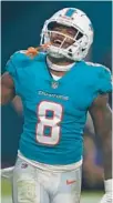  ?? JOHN MCCALL/SOUTH FLORIDA SUN SENTINEL ?? Dolphins safety Jevon Holland celebrates after Miami intercepte­d the ball against the Ravens during their game at Hard Rock Stadium on Nov. 11, 2021, in Miami Gardens.