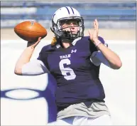  ?? Christian Abraham / Hearst Connecticu­t Media ?? Yale QB Kurt Rawlings looks to throw a pass against Holy Cross in New Haven on Sept. 21.