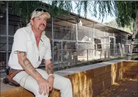  ?? AP PHOTO BY SUE OGROCKI ?? In this Aug. 28, 2013, file photo, Joseph Maldonado answers a question during an interview at the zoo he runs in Wynnewood, Okla. Maldonado known also as “Tiger King” Joe Exotic is headed to a federal courtroom Friday, Jan. 28, 2022, for a resentenci­ng hearing. He’s now in federal prison after a jury convicted him in a murder-for-hire plot involving his chief rival, Carole Baskin.