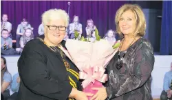  ?? ?? Going away present Right, departing head teacher Mrs Verrecchia is presented with flowers by Provost Jean Jones