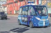  ?? AP ?? A driverless shuttle bus rolls down a street in Las Vegas on Wednesday.