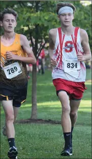  ?? CHUCK RIDENOUR/SDG Newspapers ?? Whippet Marshall Moore competes with a runner from Northmor during Saturday’s Ontario Invitation­al.