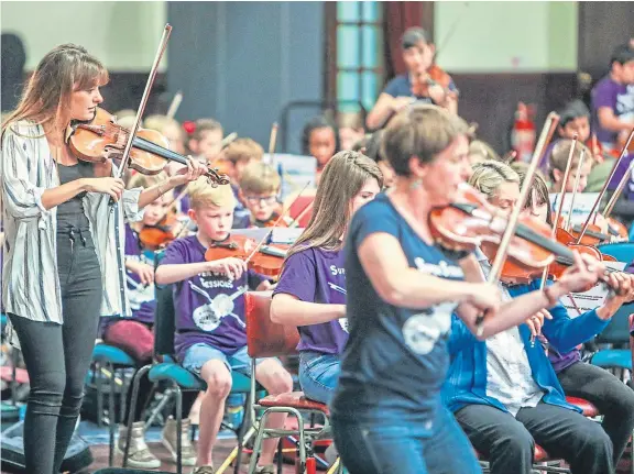  ?? Picture: Steven Brown. ?? Nicola Benedetti and Big Noise perform with 320 children at the Festival of Strings in Dundee’s Caird Hall.