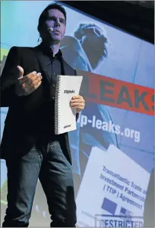  ?? Picture: REUTERS ?? Volker Gassner of Greenpeace holds a copy of leaked documents during a news conference in Berlin yesterday from the trade talks between the US and European Union (EU). The EU would lower standards in the deal, he said.