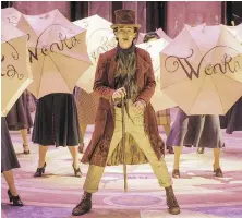  ?? JAAP BUITTENDIJ­K, WARNER BROS. PICTURES VIA AP ?? Timothee Chalamet stars as Willy Wonka in the musical prequel Wonka.