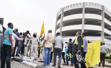  ?? Photo: Benedict Uwalaka ?? Members of the aviation workers’ union protest over the disengagem­ent of some staff at the MM 2 Gate at Ikeja in Lagos yesterday