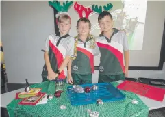  ??  ?? FESTIVE MOOD: Holy Cross School students Colin Cox, Hayden Field and Nicholas Brett.