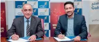  ??  ?? John Paul Alukkas and Ahmed Janahi sign an agreement forging new avenues for customers to earn more rewards.