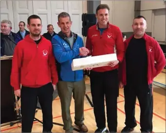  ??  ?? Colm Reilly, Jim Nolan and Gerry Mullins receiving their first-in-category prize at the BHAA 10K Road Race.
