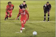  ?? Jessica Hill / Associated Press ?? Toronto FC's Alejandro Pozuelo scores a goal on a penalty kick against Inter Miami in the second half of an MLS match Sunday in East Hartford.
