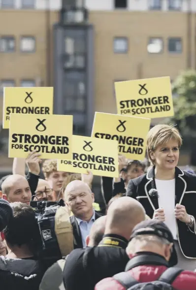  ??  ?? 0 Nicola Sturgeon, embroiled in a dispute with Labour’s Scottish leader over a telephone call last year, rallies the party faithful at a meeting in Edinburgh, as Kezia Dugdale and Ruth Davidson also made final appeals to voters