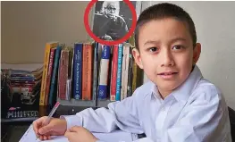  ??  ?? Prodigy: Yasha aged seven with Einstein, circled, on his wall