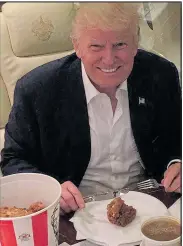  ??  ?? CUT-UP: Trump uses knife and fork on KFC