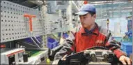  ?? PROVIDED TO CHINA DAILY ?? A technician operates machinery at Weichai Power, a leading Chinese powertrain producer in Shandong.