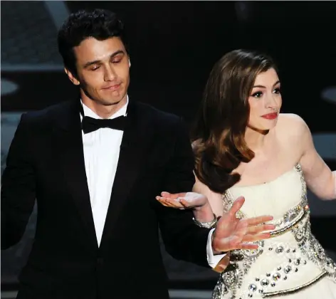  ?? GABRIEL BOUYS/GETTY IMAGES ?? Actors James Franco, left, and Anne Hathaway were roasted after hosting the Oscars together in 2011.