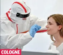  ??  ?? COLOGNE
Traveller has Covid swab test at German airport