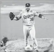  ?? Azael Rodriguez Getty Images ?? ADAM LIBERATORE celebrates after helping the Dodgers complete a no-hitter against the Padres.