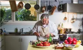  ??  ?? Stefano de Pieri in his kitchen in front of his prized copper pots. Photograph: SBS