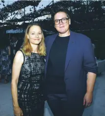  ??  ?? Hannah Gadsby, top, wants to combat the shame around autism; Gadsby and actor/ director Jodie Foster at an Emmys event in 2018, above