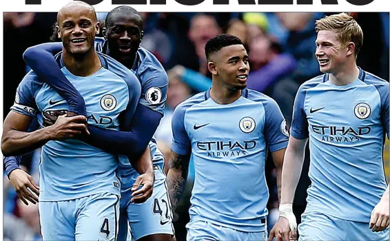  ??  ?? IN GOOD KOMPANY: Manchester City’s captain (left) is congratula­ted by team-mates after scoring the second goal in the 5-0 drubbing of Crystal Palace yesterday