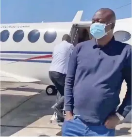  ?? ?? HIGH LIFE:
Guvamatang­a in front of the private jet he hired for his fam