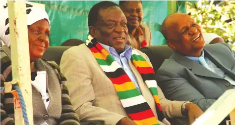  ?? —Picture: Tawanda Mudimu ?? President Mnangagwa, flanked by his sister Ms Emma Mnangagwa and Zion Christian Church (ZCC) leader Bishop Nehemiah Mutendi, follow proceeding­s at the memorial service of Garikai Nyathi in Bikita yesterday.