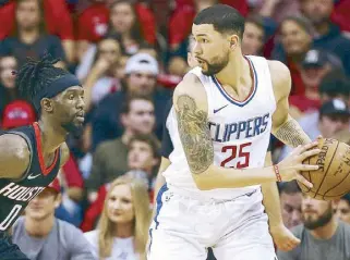  ?? REUTERS ?? LA Clippers guard Austin Rivers controls the ball as Houston Rockets guard Briante Weber defends during the first half at Toyota Center.