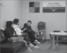  ?? BARRY GRAY, THE HAMILTON SPECTATOR ?? Refugees wait for processing at the Peace Bridge Newcomer Centre.