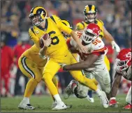  ?? K.C. ALFRED/ TRIBUNE NEWS SERVICE ?? Los Angeles Rams quarterbac­k Jared Goff is tackled by Kansas City Chiefs' Chris Jones (95) on Monday in Los Angeles.