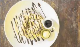  ?? YOLK ?? The new Yolk in Boca Raton offers sweet temptation­s such as Nutty Monkey pancakes.