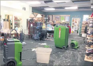  ?? PHOTO BY JUDY PETERSON ?? The American Cancer Society’s Discovery Shop in Los Gatos was flooded over the weekend when an upstairs water heater burst. Store manager Rita Melamed said volunteers are salvaging what they can and plan to move two doors down to 47 E. Main St.